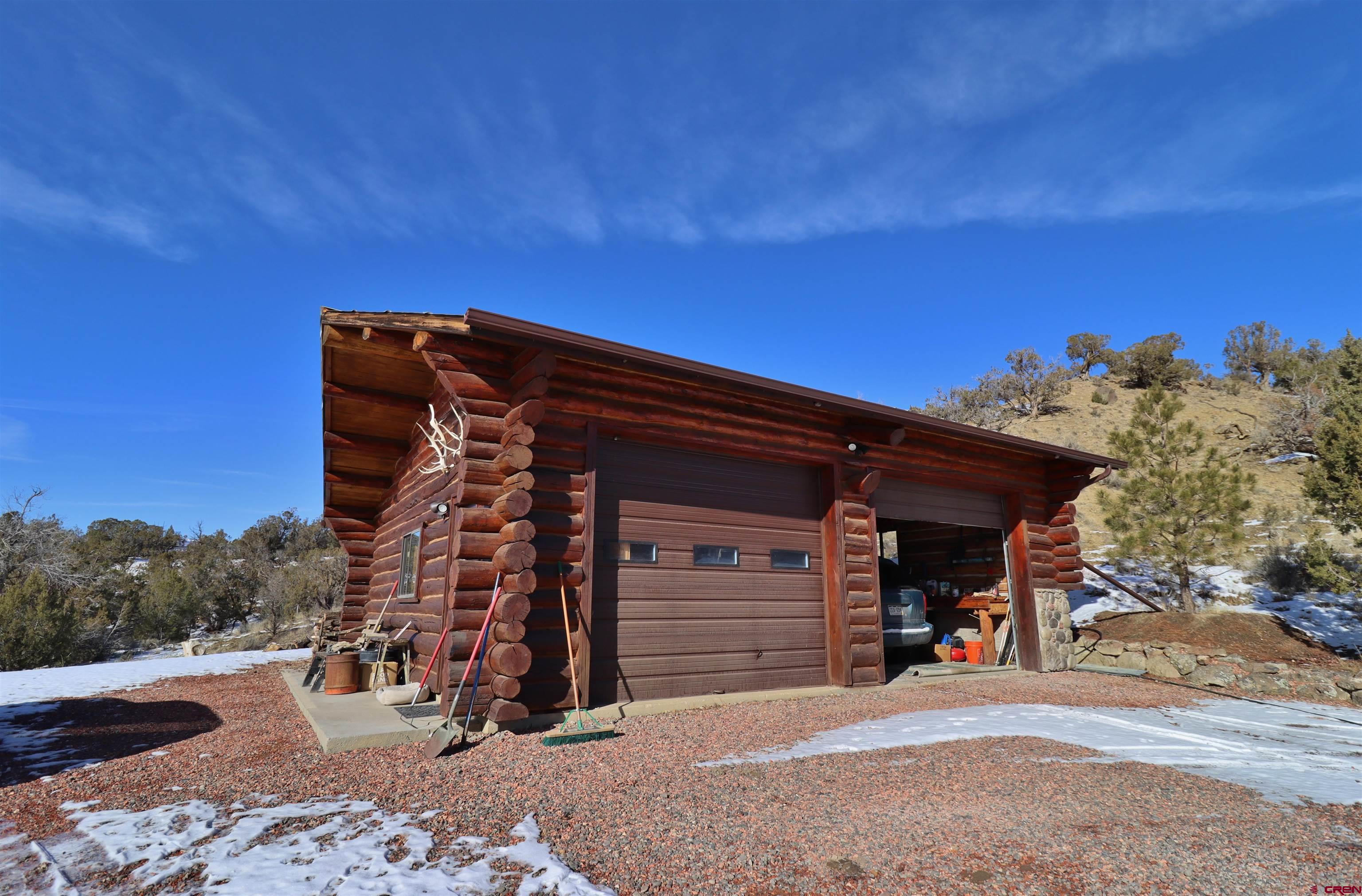 16511 Rimrock Road Cedaredge, CO 81413 - Photo 31 of 35 a view of a car garage