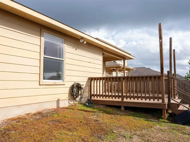 a view of a chair and table in the balcony