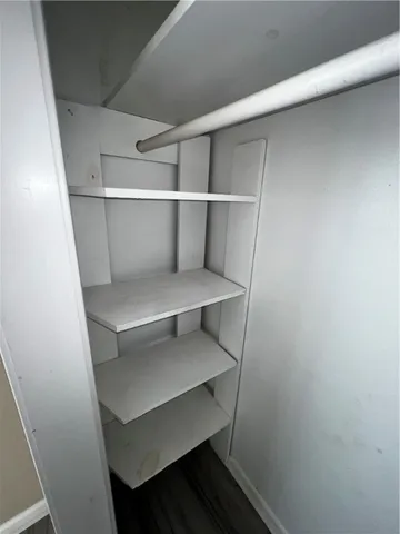 a bathroom with a toilet a sink and a mirror