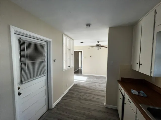 a view of a kitchen from the hallway