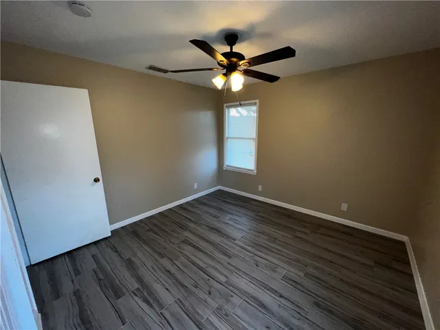 a close view of backyard and wooden floor