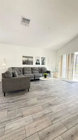a living room with furniture and a window