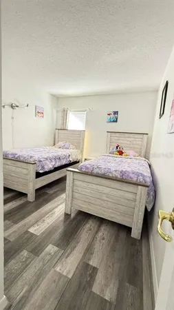 a bedroom with a bed and a view of bedroom