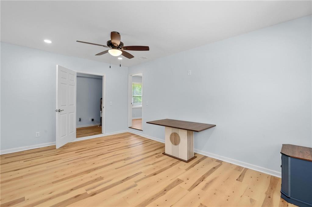 1745 Rockbridge Road Northwest Conyers, GA 30012 - Photo 21 of 32 a view of a room with a sink and a chandelier fan