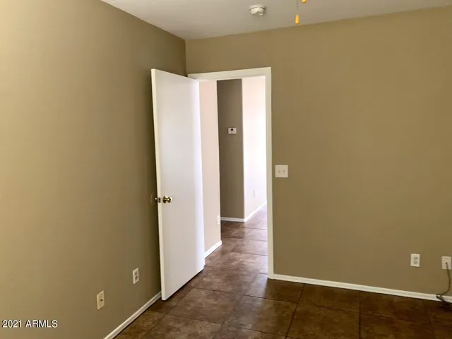 a view of bathroom with a sink and a mirror