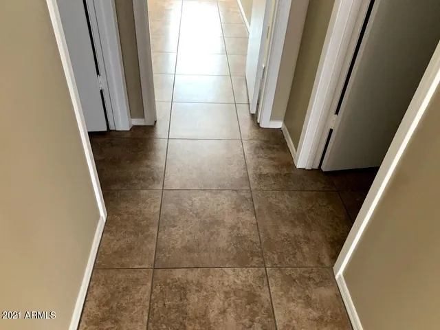 a view of a house with wooden fence