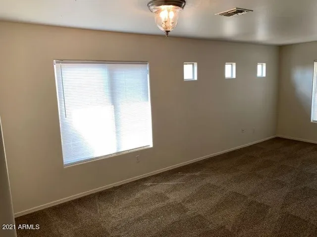 a view of hallway with a window and a mirror