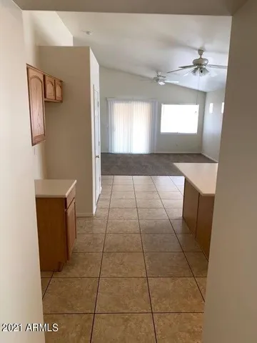 a large kitchen with cabinets and stainless steel appliances