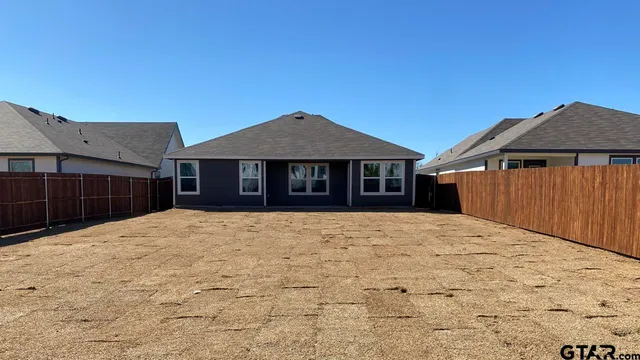 a house with yard in front of it