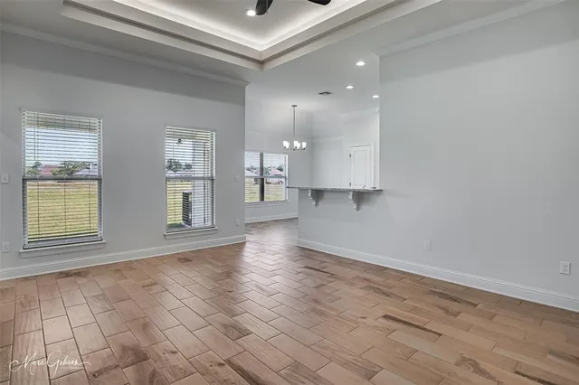 a view of an empty room and a window