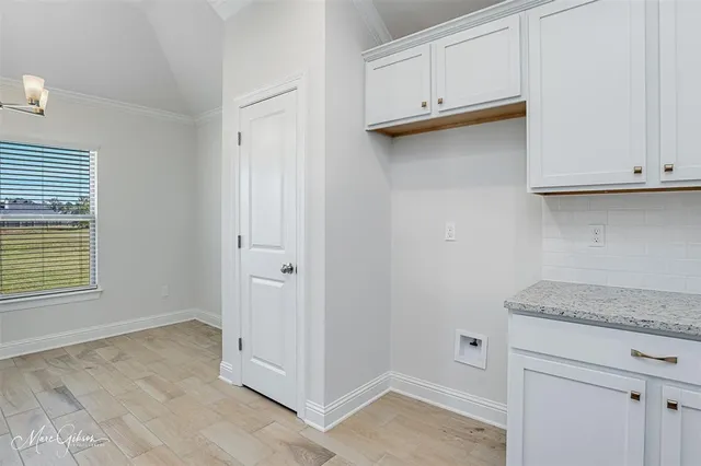 a view of a kitchen with marble countertop cabinets and a wooden floor