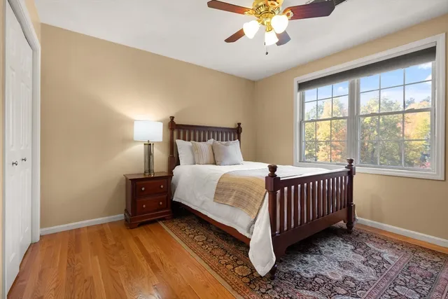 a bedroom with a bed and window