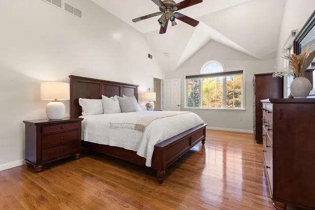 a bedroom with a bed and window