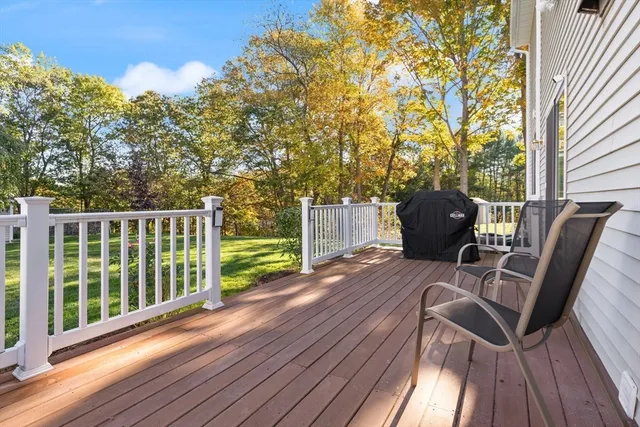 a view of balcony with furniture and wooden floor