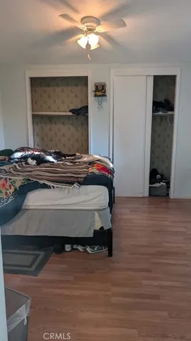 a bedroom with a bed and a mirror