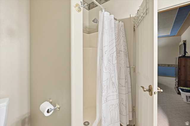 560 East 700 North Logan, UT 84321 - Photo 11 of 32 Enclosed shower stall with a neutral-toned surround and an overhead shower head