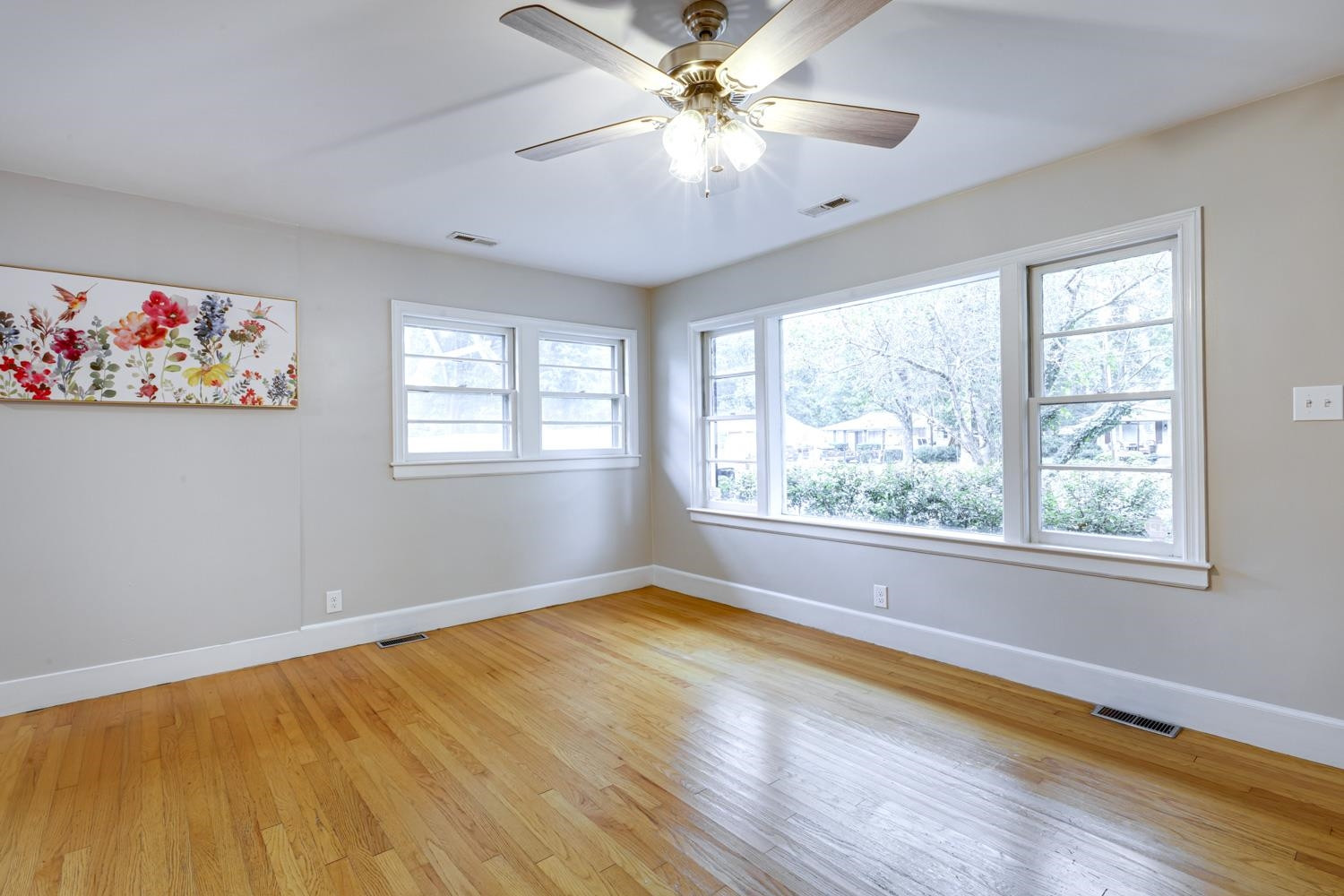 4008 Cheek Road Durham, NC 27704 - Photo 2 of 10 Wall of windows adds tons of NATURAL LIGHT to the living room Living Room