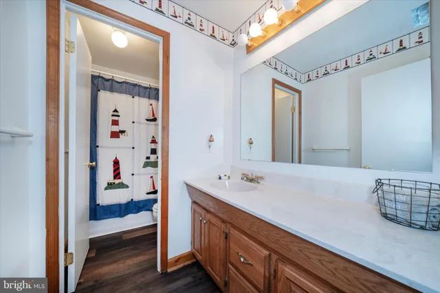 a en suite bathroom with a sink double vanity and a mirror