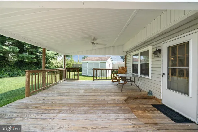 swimming pool view with a garden space