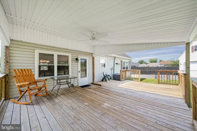 a view of a house with wooden floor and outdoor seating