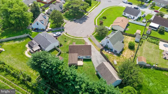 an aerial view of residential house with outdoor space and swimming pool