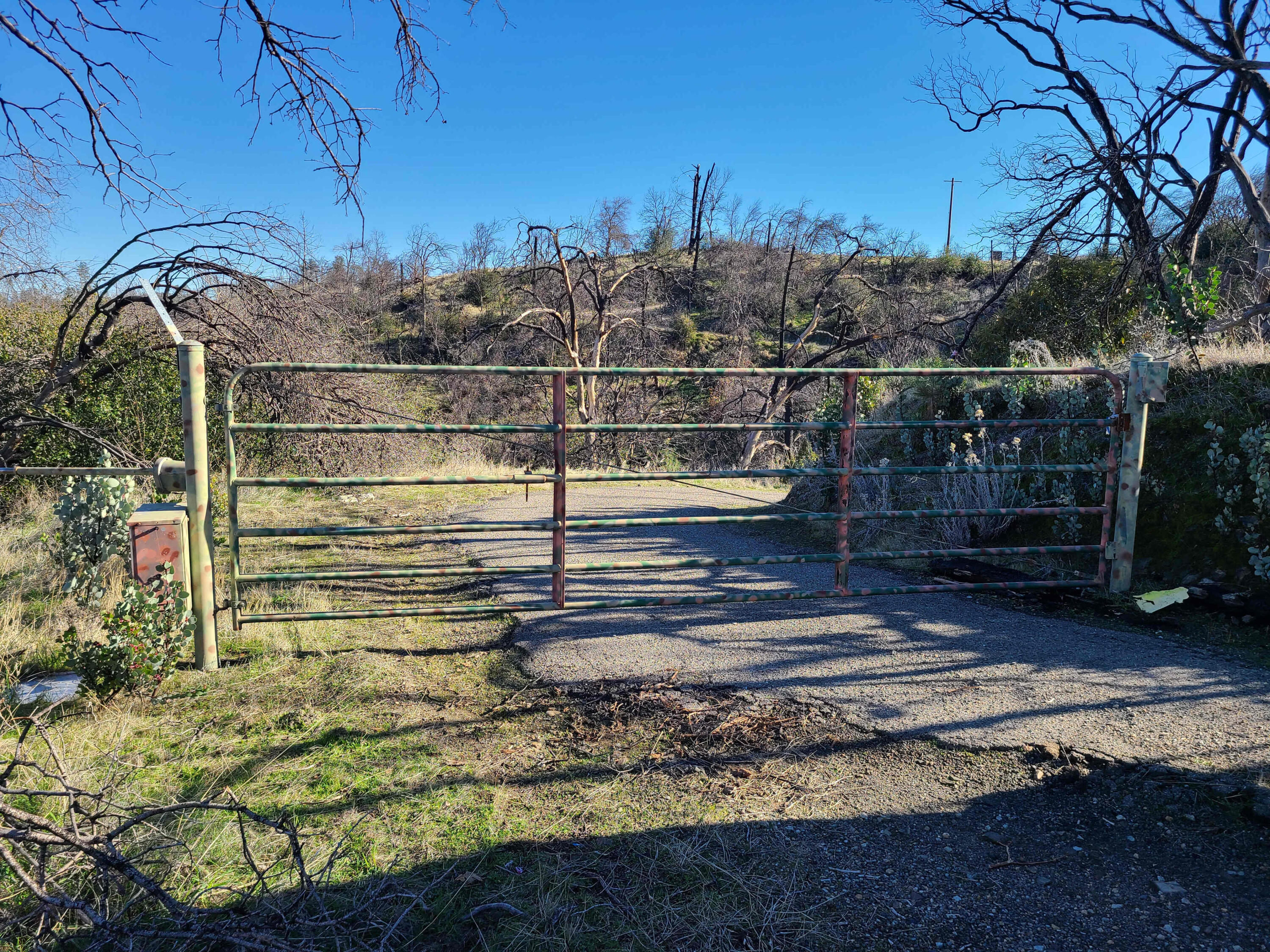 6917 Placer Road Redding, CA 96001 - Photo 14 of 28 a view of a house with a wooden fence