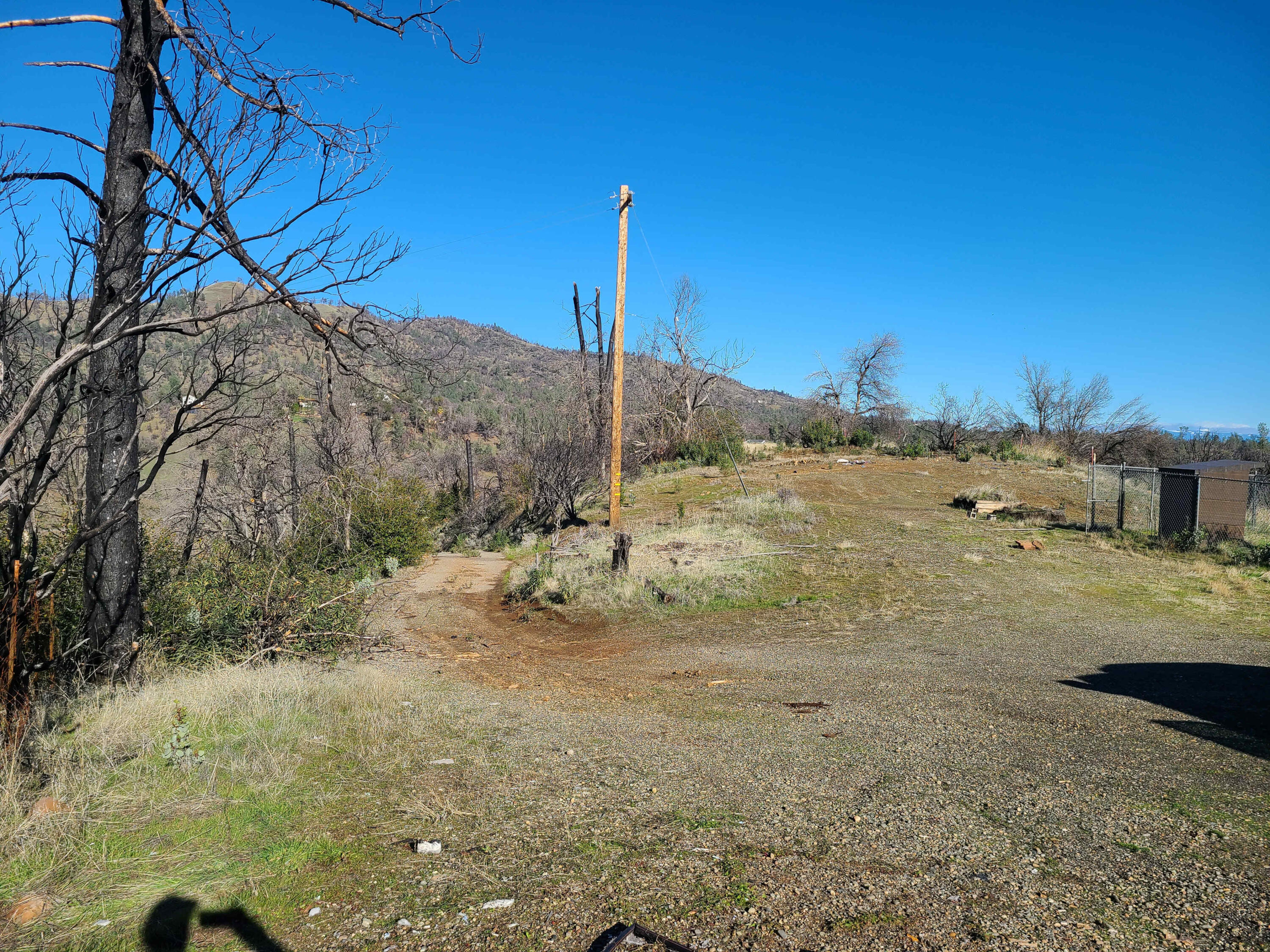 6917 Placer Road Redding, CA 96001 - Photo 8 of 28 a view of a road with a snow in the background