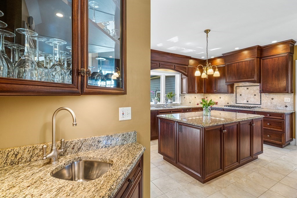 10 Pine Street Winchester, MA 01890 - Photo 14 of 40 a kitchen with stainless steel appliances granite countertop a sink and a wooden floors