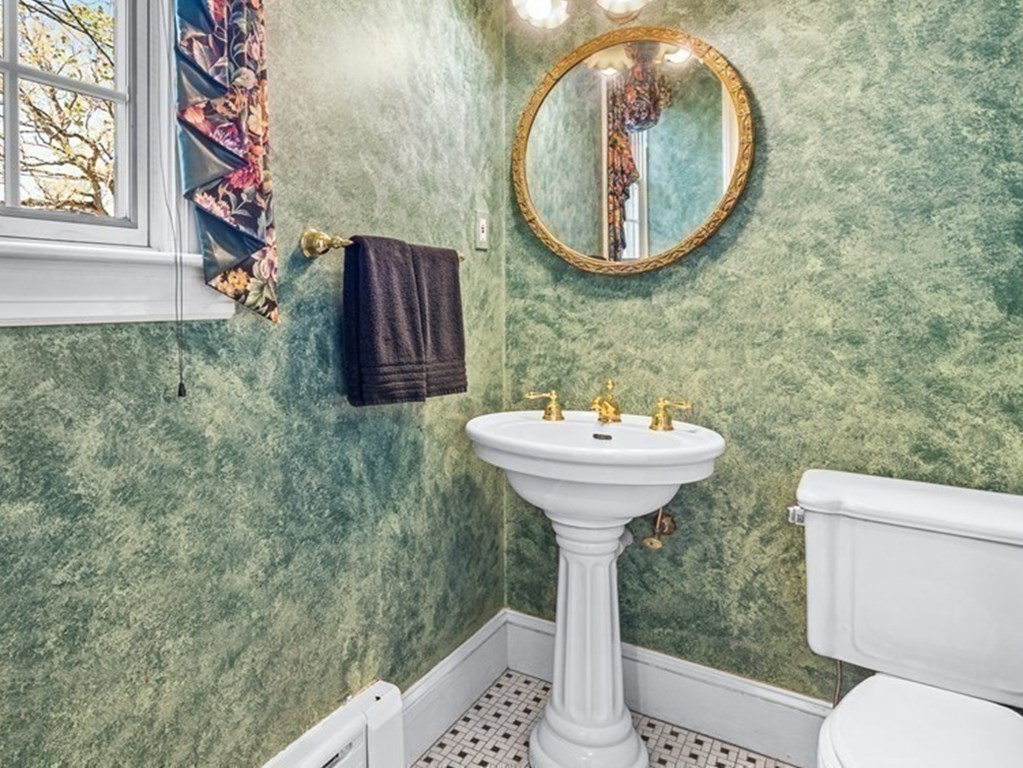 10 Pine Street Winchester, MA 01890 - Photo 19 of 40 a bathroom with a sink and mirror