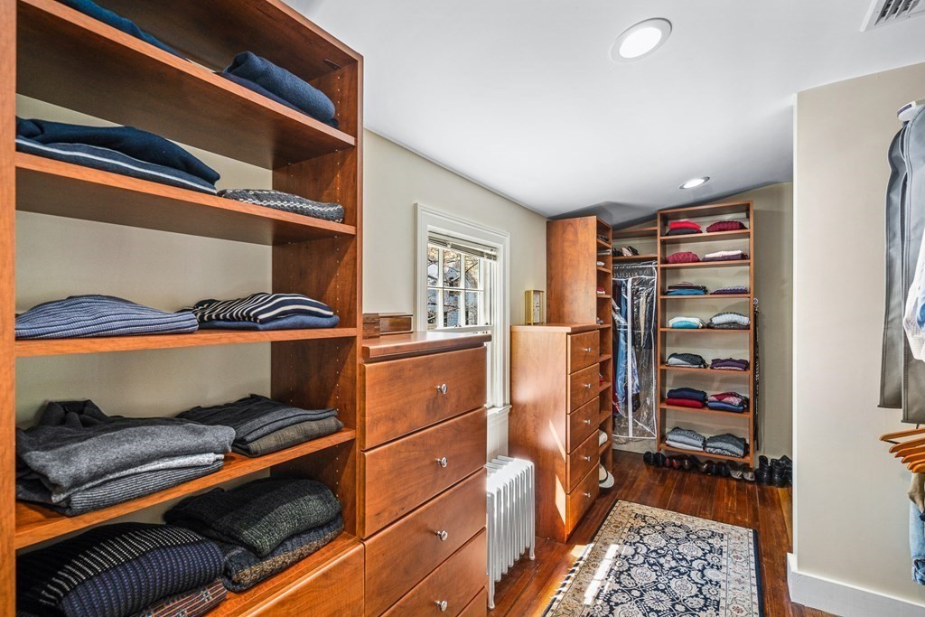 10 Pine Street Winchester, MA 01890 - Photo 22 of 40 a view of walk in closet with clothes and shoes