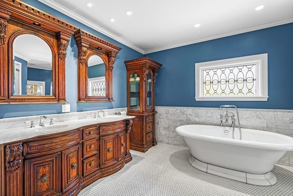 10 Pine Street Winchester, MA 01890 - Photo 23 of 40 a spacious bathroom with a double vanity sink a mirror and a bathtub