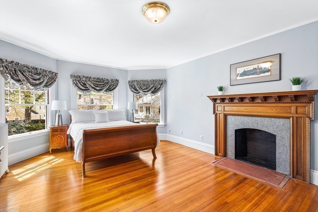 10 Pine Street Winchester, MA 01890 - Photo 25 of 40 a living room with furniture and a fireplace