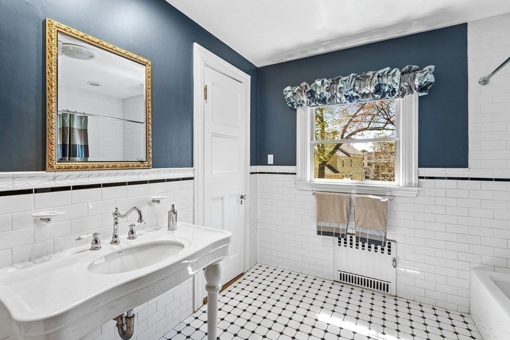 10 Pine Street Winchester, MA 01890 - Photo 27 of 40 a bathroom with a sink and a mirror