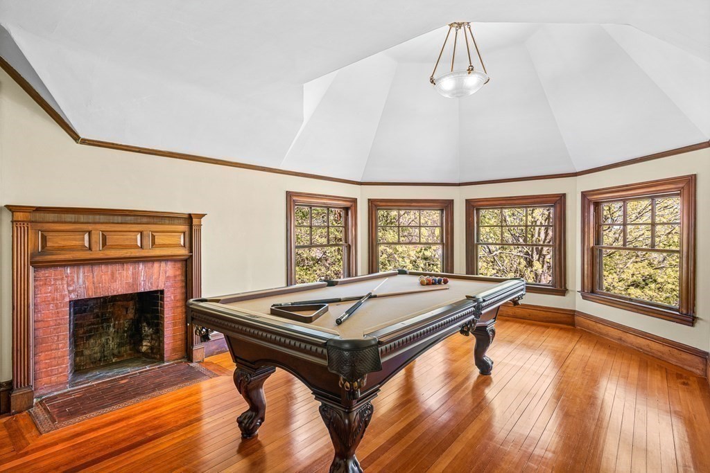 10 Pine Street Winchester, MA 01890 - Photo 31 of 40 a living room with a pool table and a fireplace