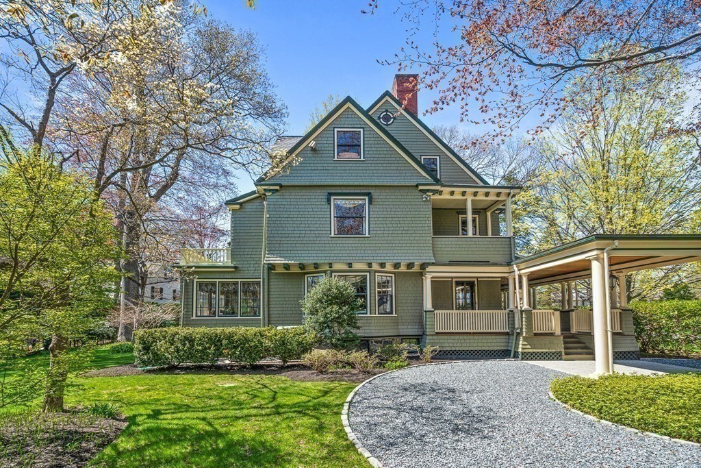 10 Pine Street Winchester, MA 01890 - Photo 34 of 40 a front view of a house with a yard and garage