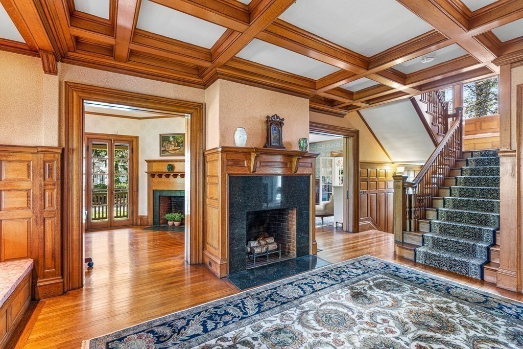 10 Pine Street Winchester, MA 01890 - Photo 5 of 40 a view of an empty room with wooden floor fire place and windows