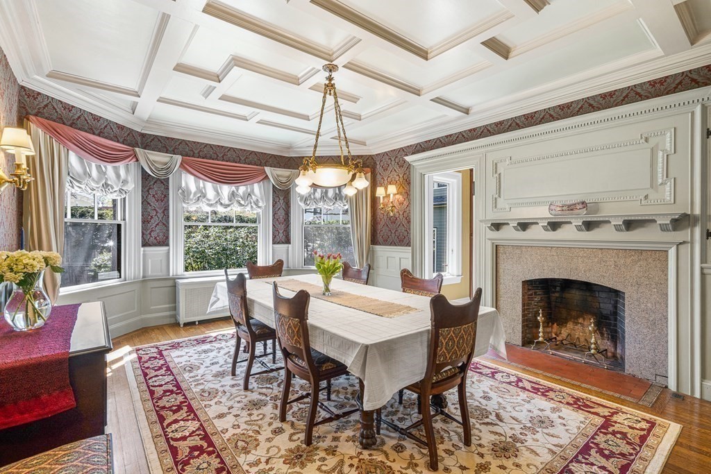 10 Pine Street Winchester, MA 01890 - Photo 9 of 40 a dining room with furniture a fireplace and wooden floor