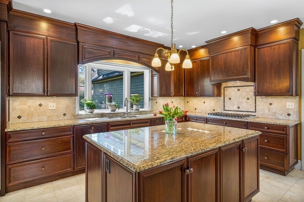 10 Pine Street Winchester, MA 01890 - Photo 10 of 40 a kitchen with granite countertop cabinets a sink and stainless steel appliances