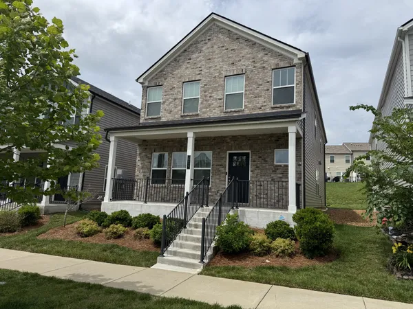 front view of a house with a yard