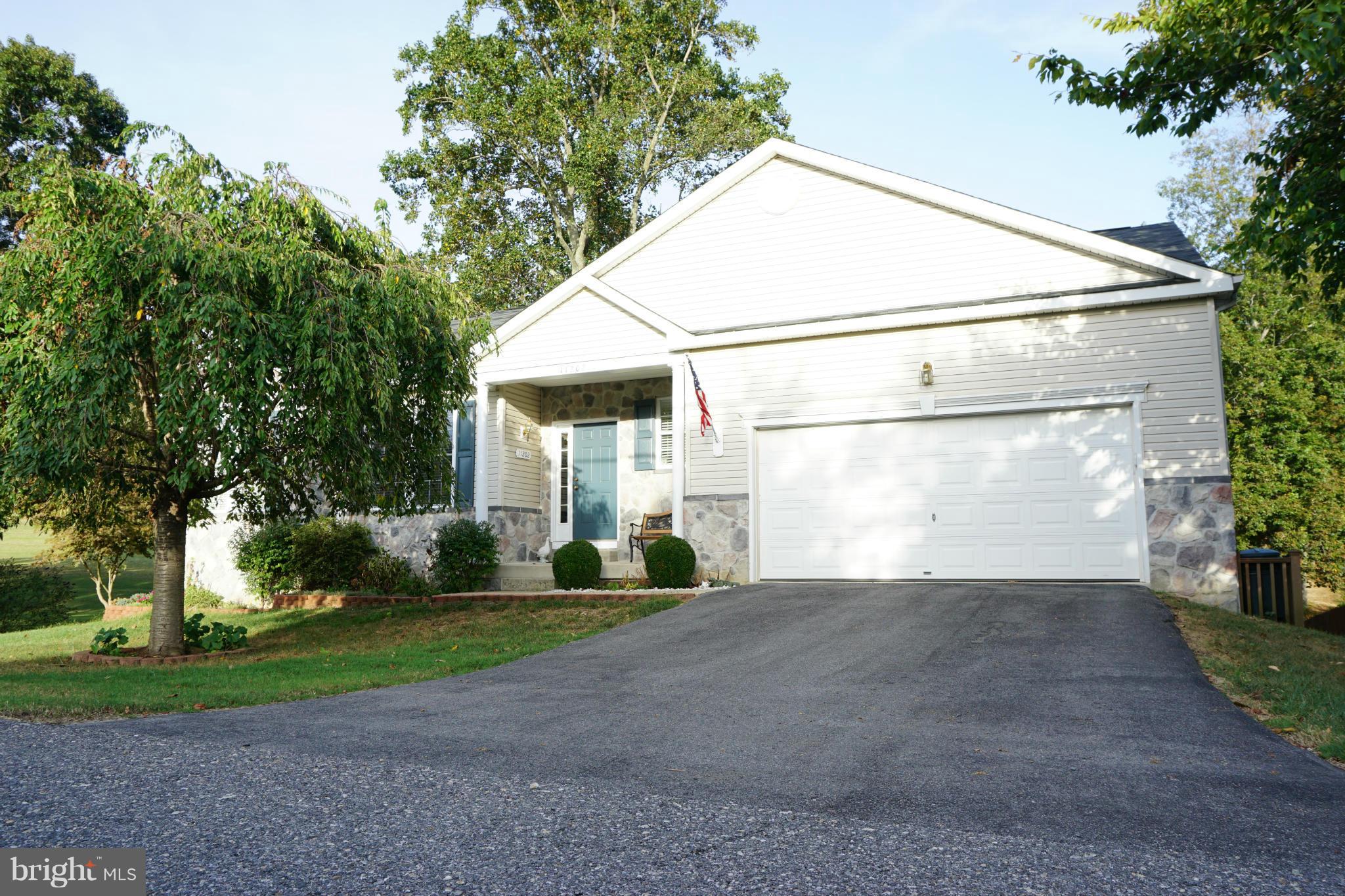 11202 Rawhide Road Lusby, MD 20657 - Photo 1 of 24 a view of a house with a yard