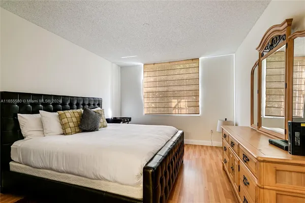 a bedroom with a bed and a window in it