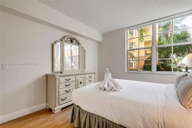 a bathroom with a sink vanity mirror and toilet