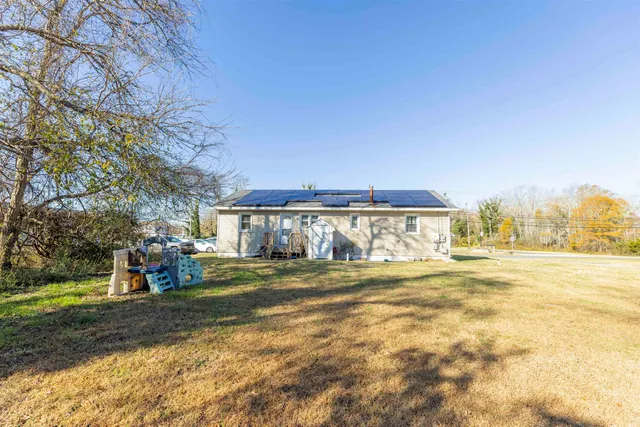 a view of a big yard in front of the house