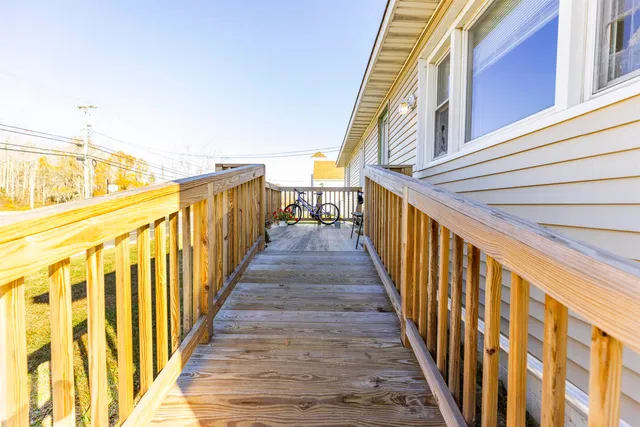 a view of a balcony with wooden floor