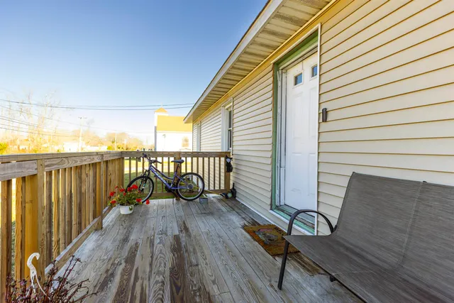 a view of a balcony with chairs