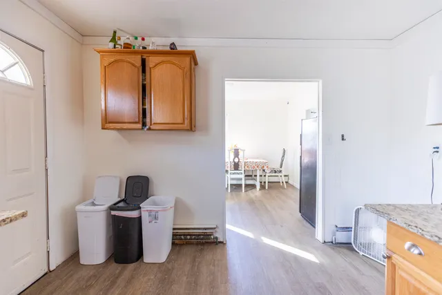 a view of living room with furniture and a wooden floor