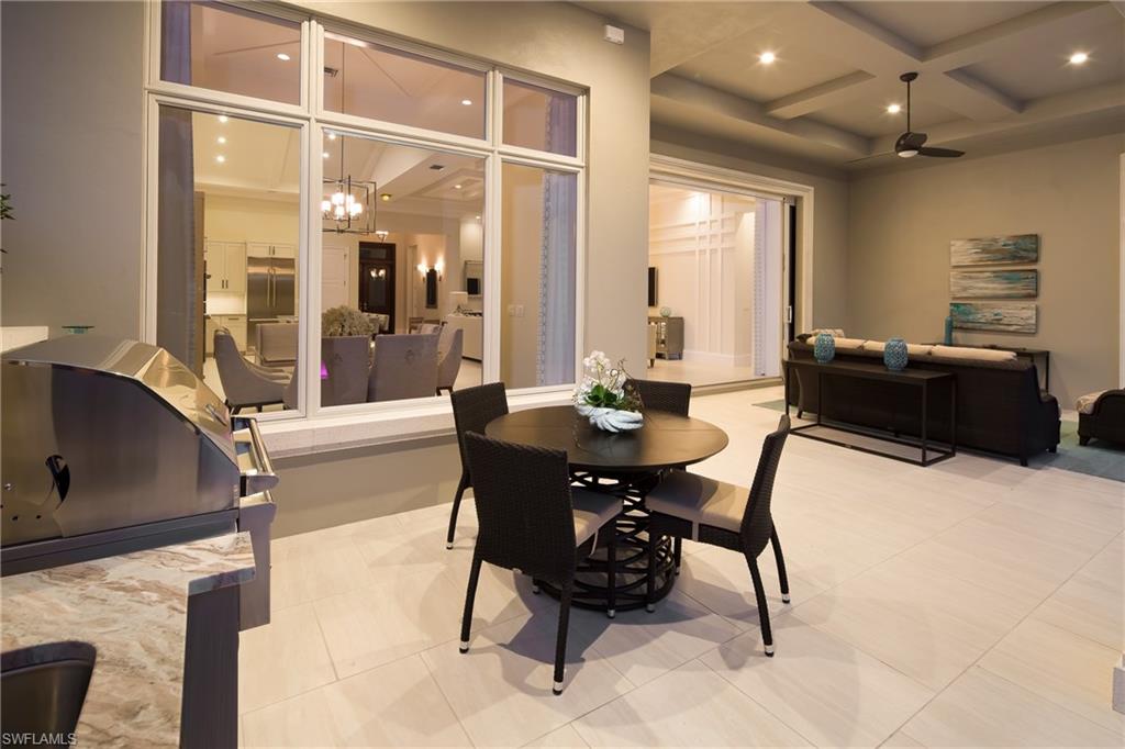 6818 Mangrove Avenue Naples, FL 34109 - Photo 15 of 24 a dining room with furniture and window