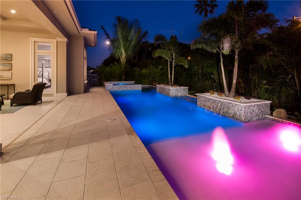 6818 Mangrove Avenue Naples, FL 34109 - Photo 19 of 24 a view of swimming pool with outdoor seating