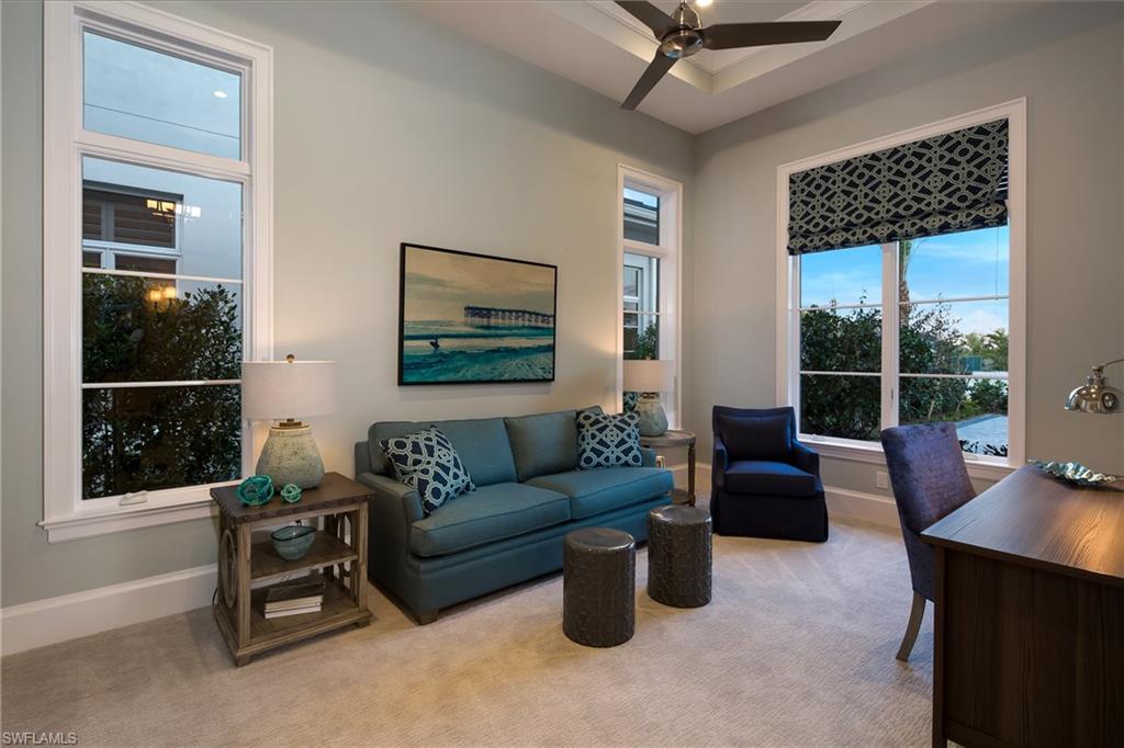 6818 Mangrove Avenue Naples, FL 34109 - Photo 21 of 24 a living room with furniture and a window