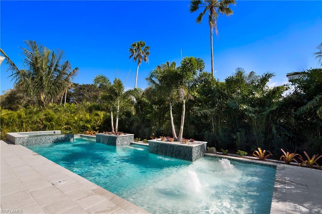 6818 Mangrove Avenue Naples, FL 34109 - Photo 22 of 24 a view of a garden with a slide